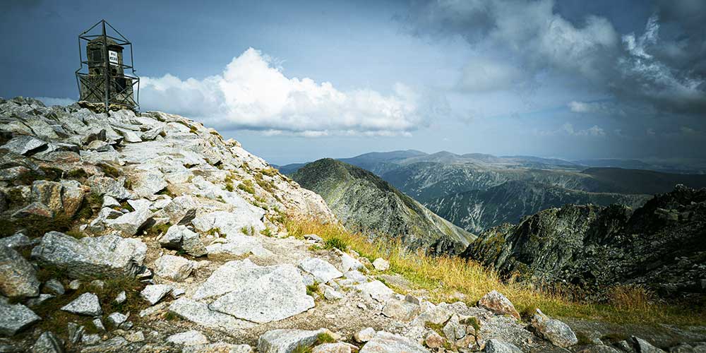Musala peak summit view at 2,925 m - panoramic vista across the Rila Mountain range, Bulgaria